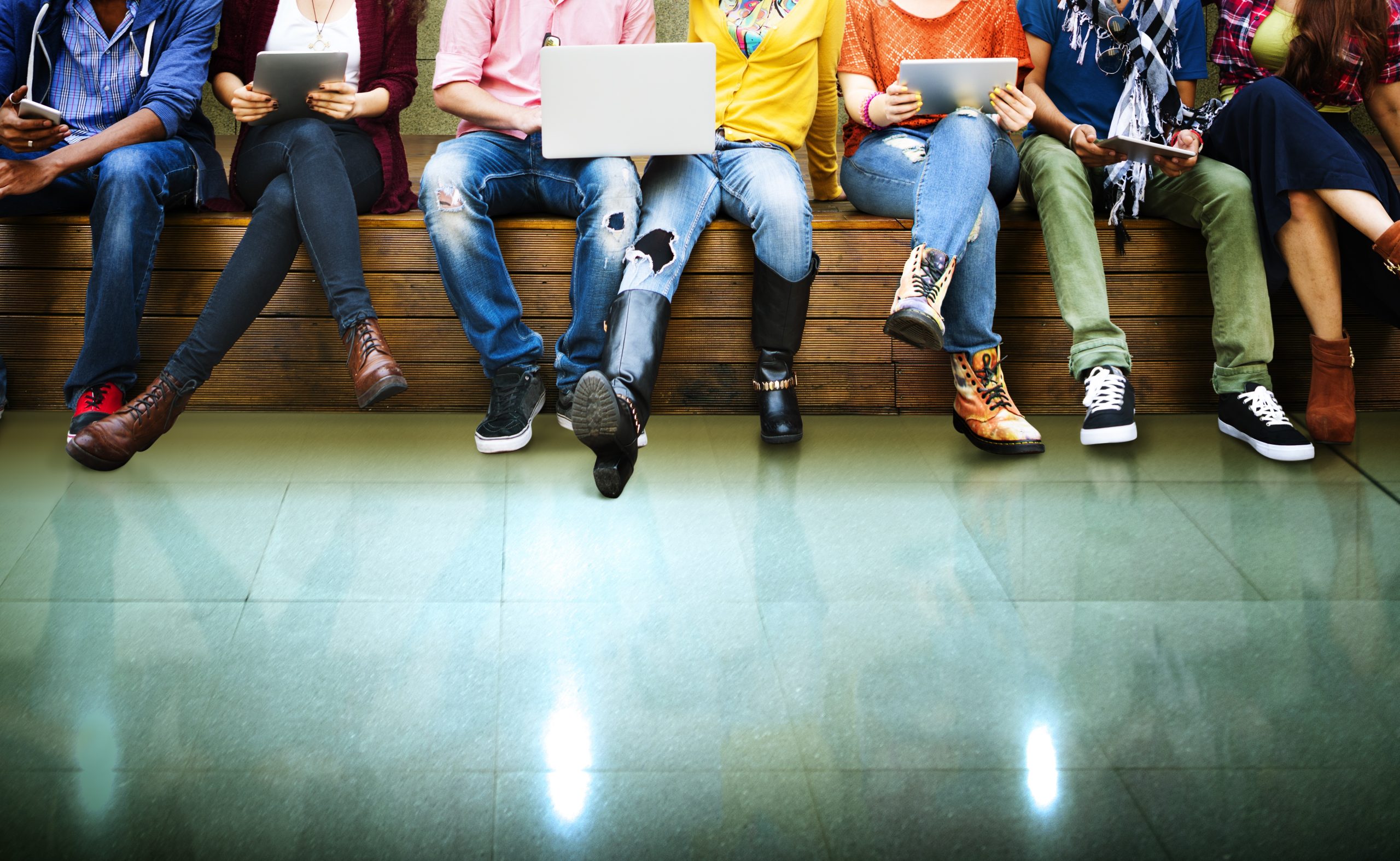 Teenagers sitting on a bench