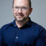 A portrait photo of Ben Sowter, Senior Vice President for Institutional Performance, looking into the camera and smiling.