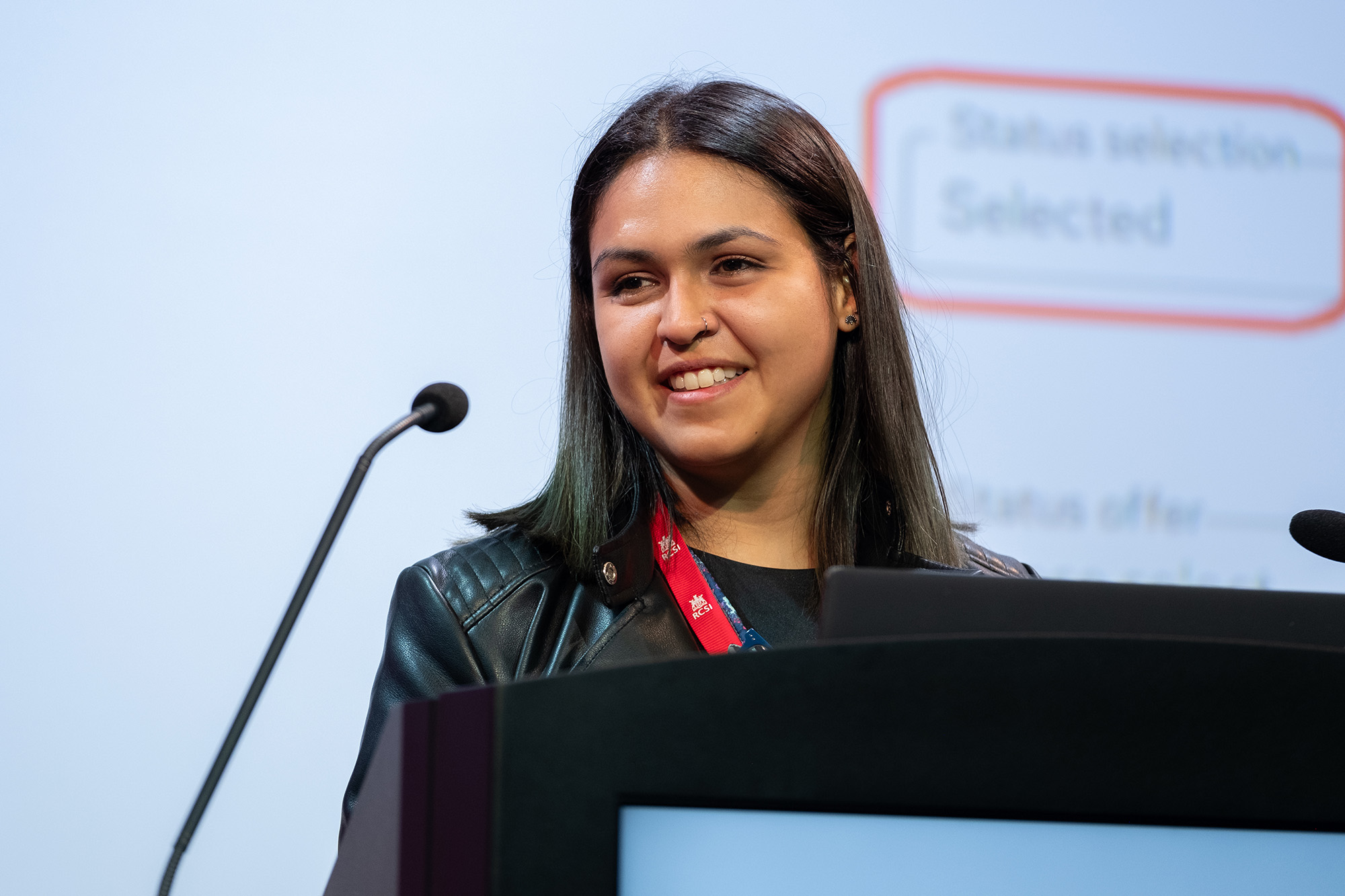 A photograph of Megan Fulmes, International Information Specialist at the University of Saskatchewan, speaking at an event.