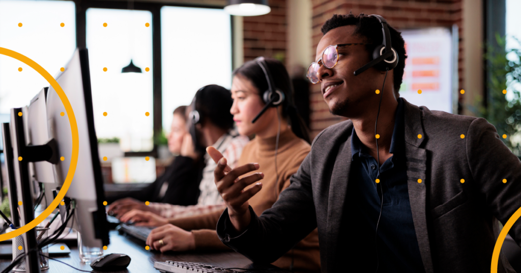 A man working with a headset on.