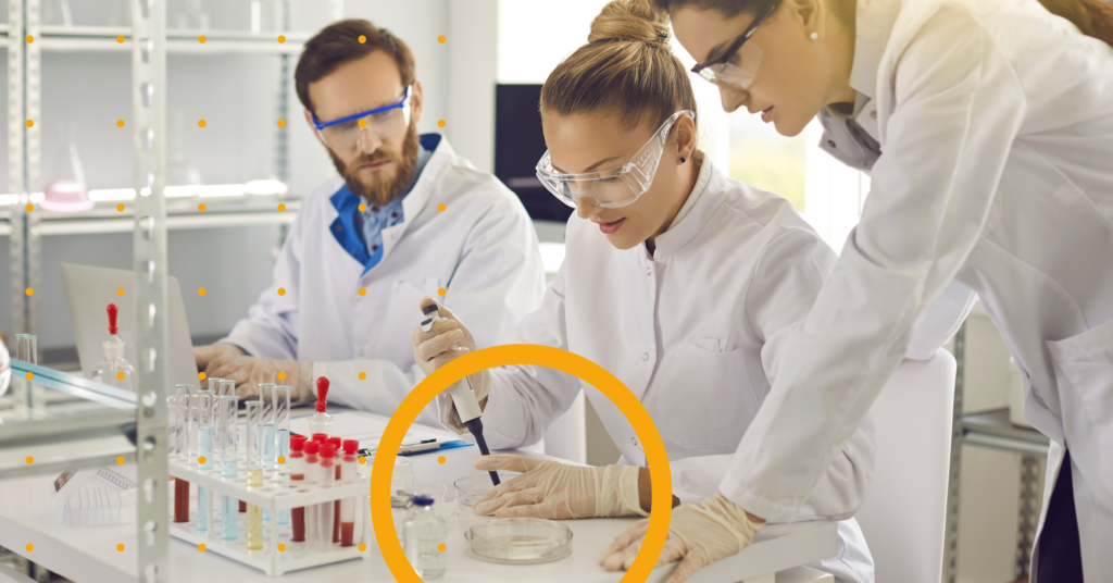 Three students working in a research lab