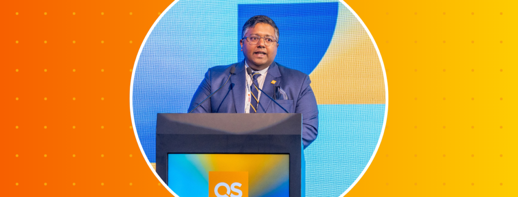 Dr Ashwin Fernandes speaking at a QS Summit.