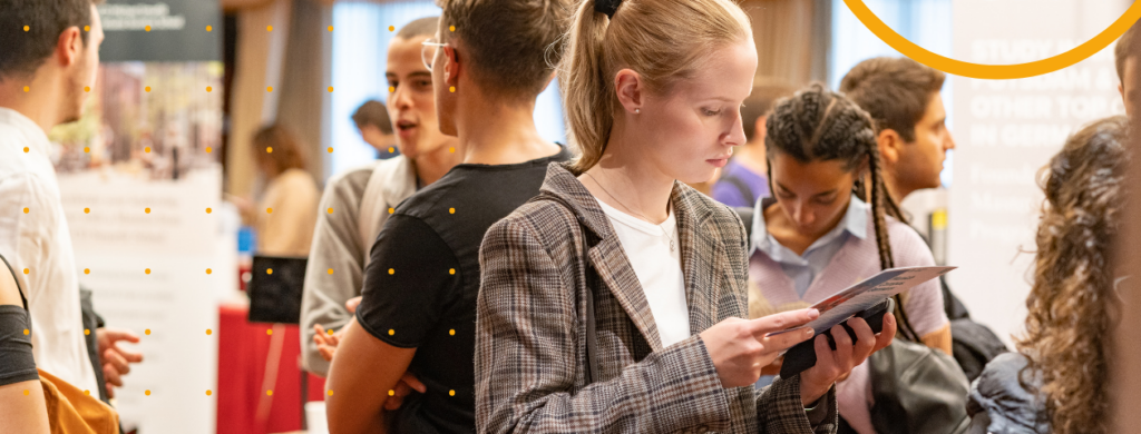 A student at a student recruitment fair