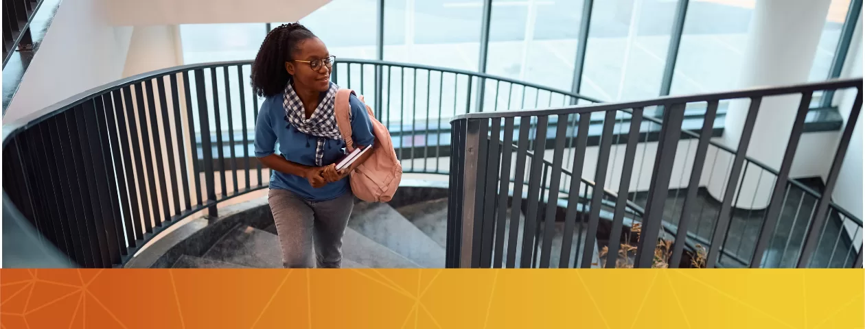 A student climbing the stairs.